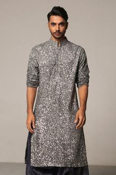 Ombre pewter and gunmetal straight kurta with all-over hand sequin work. Comes with organza charcoal patiala pants.
Component: 2
Embroidered
Neckline: Mandarin Collar
Sleeve Length: Long
Fabric: Kurta: Georgette; Pant: Organza
Color: Grey
Concealed placket
Side slits - Aza Fashions Indo Western Outfits For Men, Grey Kurta, Wedding Kurta For Men, Black Outfit Men, Men's Wedding Outfit, Gents Kurta, Men Kurta, Kurta Men, Kurta Set For Men