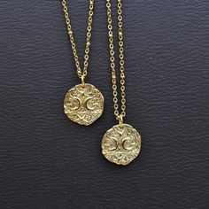 Shape: Coin Design: Moons & Stars Chain Length: 16-36inches Dimensions: 0.80inches x 0.80inches (20mm x 20mm) Color: Gold Chain: Gold Stainless Steel Chain SKU: EPJ-NC19CAB16 If you are in love with the stars as much as I am you neeeeed this necklace. This gold plated charm embodies the magic of the night sky. The charm has a textured surface with two crescent moons and stars that make this charm sparkle with enchantment. The necklace is finished off with a stainless steel chain that is also plated with gold. Oh and great news! You can select the chain style you prefer. Lots to pick from so choose wisely! Please choose the length you would like the necklace in. Please choose the chain style you would like your pendant on. Please note that all necklaces are handmade and may differ from the Celestial Medallion Necklace With Adjustable Chain, Gold Moon-shaped Engraved Necklace, Engraved Moon-shaped Brass Necklace, Engraved Brass Moon Necklace, Engraved Moon Shaped Brass Necklace, Celestial Pendant Charm Necklace With Adjustable Chain, Celestial Metal Necklace With Moon Charm, Celestial Medallion Necklace With Moon Charm, Celestial Moon-shaped Engraved Necklace