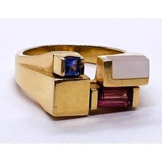 Kabana 14k Gold Ring Set With Mop, 2 Color Stones Condition: Used Material: 14k Yellow Gold Ring Size: 6 Weight: 6.4 Grams Top Width: 9mm Bottom Width: 3mm Stone Info: Set With Mother Of Pearl Inlay, 6mm X 3mm Baguette Cut Pink Stone And A ,2.5mm Square Stone. Its Hard To Make The Color Of It It Looks Purple From One Angle And Blue From Another Modern 14k Gold Multi-stone Jewelry, Yellow Gold Multi-stone Art Deco Jewelry, Art Deco Multi-stone Yellow Gold Jewelry, Art Deco Yellow Gold Multi-stone Jewelry, Modern Gold Multi-stone Jewelry, Modern 14k Gold Pink Jewelry, Modern Gold Multi-stone Sapphire Ring, Modern Gold Sapphire Ring With Multi-stone, Multicolor Sapphire Ring In 14k Gold