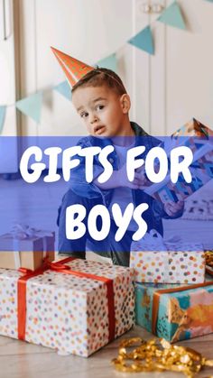 a young boy sitting on the floor with presents in front of him and text that reads gifts for boys