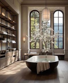 a bathroom with a large bathtub and two windows