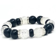 Black and white beads with onyx rings bracelet. Black Onyx Is a powerful protection stone, it absorbs and transforms negative energy, and helps to prevent the drain of personal energy. Black Onyx aids the development of emotional and physical strength and stamina, especially when support is needed during times of stress, confusion or grief. Use Black Onyx to encourage happiness and good fortune. It is a strength-giving stone and can provide support for self-discipline issues, it is wonderful for Black Crystal Bracelet With Natural Stones For Healing, Black Onyx Crystal Bracelet With Natural Stones, Black Agate Crystal Bracelet With Gemstone Beads, Black Agate Bracelet With Gemstone Beads, Spiritual White Bracelet With Black Beads, Black Agate Bracelet With Natural Stones, Onyx Crystal Bracelet With 8mm Round Beads, Silver Onyx Bracelets With 8mm Beads, Black Agate Round Crystal Bracelet