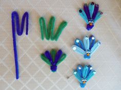 some blue and green hair clips on a table