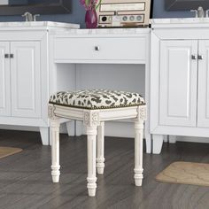 a white vanity with a leopard print stool