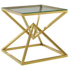 a gold metal and glass side table with an angled design on the top, against a white background