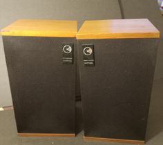 two speakers sitting on top of each other