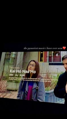 a man and woman standing in front of a tv screen with the words kal ho na ho on it