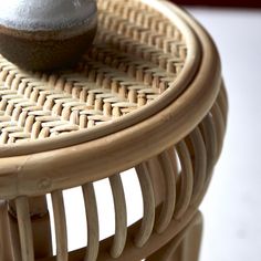 a cupcake sitting on top of a wicker table