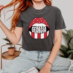 *Also available as a sweater. See below.* Welcome to the ultimate gameday wardrobe addition! This UGA Lips T-Shirt not only boasts trendy style, but also shows off your team spirit for UGA football. Stay cozy and stylish while supporting your favorite team. Go dawgs! Uga Football, Go Dawgs, Trendy Style, Stay Cozy, Kid Tees, Team Spirit, Large White, Favorite Team, Comfort Colors