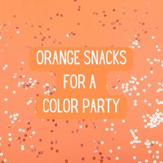 orange snacks for a color party with confetti and sprinkles on an orange background