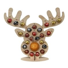 a wooden reindeer ornament with different colored balls on it's antlers