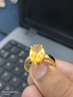 Yellow sapphire, also known as "Pukhraj" in Hindi, is a gemstone that belongs to the corundum family, just like blue sapphire. It is the yellow variety of corundum and is valued for its vibrant yellow color. Yellow sapphire is composed of aluminum oxide (Al2O3) with traces of iron that give it its yellow hue. The color of yellow sapphire can range from pale yellow to intense golden yellow. The most prized and valuable yellow sapphires typically exhibit a pure, vibrant yellow color without any hi Yellow Gemstone Ring, Cultural Beliefs, Vedic Astrology, Yellow Gemstones, Light Reflection, Yellow Sapphire, Yellow Color, Handmade Ring, Rings Statement