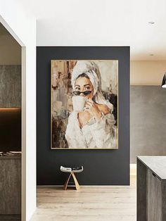 a kitchen with a painting on the wall