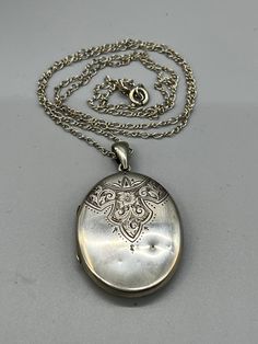 A beautiful Victorian extra Large Decorative sterling Silver oval shaped locket & 30 inch sterling silver Chain In very good condition, There is minor wear, there are also a couple of small dents on the locket, all of which is entirely commensurate with its age however please ensure you study my pictures carefully and decide for yourself upon the condition of the before purchasing The locket is not hallmarked, but this is not unusual for the Victorian era. The locket is fully tested and tests fo Silver Hallmarked Locket Necklace Collectible, Collectible Hallmarked Silver Locket Necklace, Vintage Silver Oval Pendant Locket Necklace, Vintage Sterling Silver Oval Pendant Locket Necklace, Oval Silver Chain Jewelry, Antique Sterling Silver Locket Necklace With Oval Pendant, Vintage Antique Silver Oval Locket Necklace, Vintage Sterling Silver Oval Locket Necklace, Vintage Oval Locket Necklace In Antique Silver