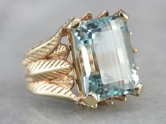 One of the finest aquamarines we've seen, this stone is the benchmark for this favorite gem. The color is a deep, true aquamarine, even and rich, and the cutting and polish of the gem create an intense play of light in the setting. We've mounted this beautiful aquamarine in a vintage, substantial ring that is detailed without being overly feminine. Luxurious and extremely rare, this intense gem is a collectors item of the highest quality. Material: 14K Yellow Gold Gem: Aquamarine 12.85 Carats Ge Bohemian Style Rings, Stil Boho, Aquamarine Jewelry, Styl Boho, Aquamarine Rings, Unisex Ring, Watches Women Fashion, Men's Jewelry Rings, Boho Stil