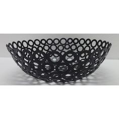 a black bowl with circles on it