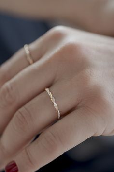 Purveyors of fine and delicate jewelry, Atelier Petites Pierres have created another ultra-desirable piece that would add elegance and refinement to any collection. This handmade dual vine twisted style ring is crafted from 14K rose gold and features a white diamond accent on one of the vines. Creating a stunning visual 'alternating' effect, it truly is eye-catching and makes for a fresh and unexpected take on a standard band ring. The diamond detail is semi-infinite and surrounds one of the two Rose Gold Twist Wedding Band, Minimal Engagement Ring And Wedding Band, Modern Twist Stackable Diamond Promise Ring, Modern Twist Diamond Cut Ring For Anniversary, Modern Style Diamond Cut Rings For Anniversary, Modern Twist White Gold Diamond Ring For Wedding, Modern Twist Diamond Stackable Rings For Anniversary, Delicate Halo Design Ring For Anniversary, Delicate Anniversary Ring With Halo Design