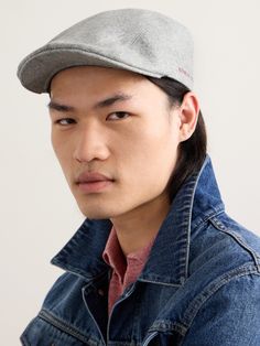 "But how does a man wear a flat cap without looking like a pétanque-playing French pensioner?...By looking like an artist instead" says The Journal. Taking this advice, Brunello Cucinelli's hat is made from virgin wool-flannel in a versatile navy offset with contrasting embroidery and a leather back tab. Team yours with a crisp white tee and pleated trousers. Mens Leather Hats, Flat Cap Men, Denim Baseball Cap, Gray Accessories, Tom Ford Bag, Brunello Cucinelli Men, Embroidered Leather, Wool Flannel, Embroidered Baseball Caps