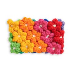 multicolored crochet flowers on white background