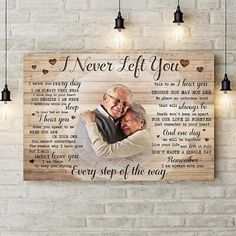 a wooden plaque with an image of two people hugging each other and the words i never left