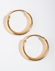 Description
Invest in some quality basics that are perfect for everyday wear. These earrings are plated with genuine gold, and are made from sterling silver so they're gentle on ears. This pack includes two pairs of gold sleeper hoop earrings.

Earring size: 14mm (L) x 14mm (W) 
Weight: 0.5g (one earring) Quality Basics, Fashion Jewellery Online, Bold Earrings, Favorite Rings, Nose Piercing, Ear Jewelry, Gold Plated Sterling Silver, Eminem, Ring Necklace