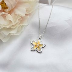 This Sterling Silver Plumeria Necklace is the perfect accessory for anyone looking to add a touch of Hawaiian-inspired style to their summer jewlery collection. Crafted with 925 sterling silver, this beautiful necklace features a colorful plumeria flower surrounded by intricate detail. The ideal beach gift, this plumeria pendant is sure to make a lasting impression. - Comes ready to wear on a 925 sterling silver chain of your choice length. Comes standard on a box style chain.  - solid sterling Yellow Sterling Silver Flower Jewelry, Flower Shape Jewelry As A Gift With Polished Finish, Flower Shaped Polished Jewelry As Gift, White Sterling Silver Jewelry With Flower Charm, Flower-shaped Polished Jewelry Gift, Sterling Silver Flower-shaped Jewelry Gift For Her, Flower Shaped Jewelry With Polished Finish For Gift, Sterling Silver Flower Shaped Jewelry Gift For Her, Nickel Free Sterling Silver Flower Necklace