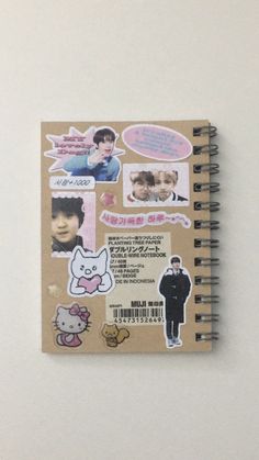 a notebook with stickers on the cover