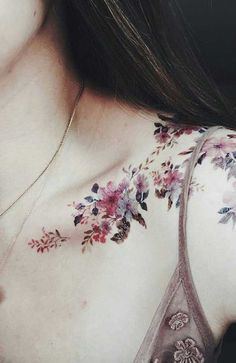 a woman's chest with flowers on it