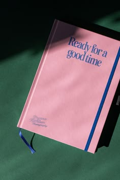 a pink book with the words ready for a good time written in blue on it