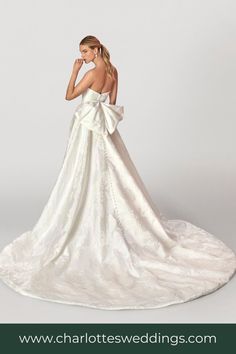 a woman in a white wedding dress with a big bow on her back and the words charlottesweddings com