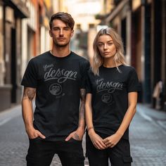 INSTANT DOWNLOAD - no physical item will be delivered Couple in black T shirts mockup. Embrace urban chic with our Couple Street Style Black T-Shirt Mockup. This captivating mockup showcases a trendy couple in black shirts against a vibrant street backdrop. Perfect for showcasing your stylish designs and attracting fashion-conscious individuals. Elevate your sales and captivate your audience with this dynamic couple mockup. Once your payment is cleared, you will receive an email with the download link. You can also access your purchase via your Etsy profile. Download the files, and start working on your images.  The high-resolution JPG file of t-shirt mockup will be blank and without any watermarks. Use any image editing software and add your design on top of the base image. Now you can up Black Short Sleeve Branded T-shirt, Basic Black Pre-shrunk T-shirt, Band Merch T-shirt For Streetwear, Urban Black Crew Neck T-shirt, Black Crew Neck Urban T-shirt, Black Urban Crew Neck T-shirt, Black Pre-shrunk Band Merch T-shirt, Black Urban T-shirt With Printing, Black Urban Short Sleeve T-shirt