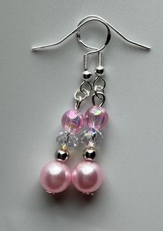 Pink Pearl Beaded Earrings, Pink Beaded Dangle Pearl Earrings, Pink Pearl Jewelry With Ear Wire, Elegant Pink Crystal Earrings With Round Beads, Pink Adjustable Pearl Drop Earrings, Adjustable Pink Pearl Drop Earrings, Pink Dangle Pearl Earrings, Elegant Iridescent Beaded Earrings For Gift, Elegant Pink Pearl Drop Beaded Earrings