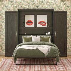 a bedroom with a bed, dressers and two paintings on the wall behind it