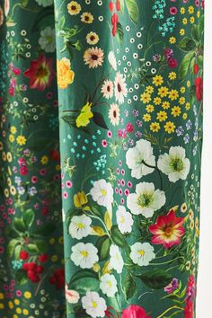 green floral curtains with white and red flowers