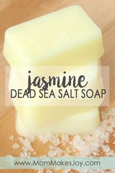 a bar of dead sea salt soap sitting on top of a wooden table with the words jasmine dead sea salts