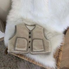 This Sherpa Button-Down Vest for babies is the perfect choice for chilly winter days! 🥰 Its soft cotton material provides warmth and comfort, while its O-Neck collar and solid pattern provide an adorable look. 😍 In addition, its true-to-size fit ensures the vest fits your baby perfectly. Specifications: Material: Cotton Item Type: Vest Age Range: 0–24 months Department Name: Baby Collar: O-Neck Season: Winter Material Composition: Cotton Pattern Type: Solid Fit: Fits true to size; take your no Cute Cotton Warm Outerwear, Cute Warm Cotton Outerwear, Warm Cozy Fit Cotton Outerwear, Comfortable Beige Winter Outerwear, Cute Winter Outerwear With Buttons, Warm Cozy Cotton Outerwear, Cozy Cotton Outerwear With Buttons, Casual Soft Winter Outerwear, Cute Brown Winter Outerwear