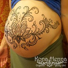 a woman's belly with an intricate design on it