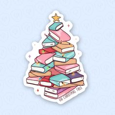 a christmas tree made out of books on a blue background with the words merry christmas written below it