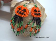 Stylish earrings for Halloween, Seed bead pumpkin earringsThese pumpkin earrings for Halloween are specially made for you to emphasize your style for the holiday.They emphasize your style and help you stand out from everyone else.This earrings is made from the high-quality Czech bead, with the use of sterling silver furnice, with a bright pumkin pattern. This pumpkin earrings can carry every girls and woman of any age, harmonizes with any clothes.Earrings details:Length: Dangle earrings measure Beaded Pumpkin Earrings, Halloween Seed Bead, Bead Pumpkin, Beaded Pumpkin, Earrings Handmade Beaded, Witch Pumpkin, Pumpkin Bead, Halloween Beads, Earrings Halloween