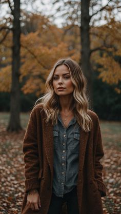 Woman wearing a brown wool coat over a denim shirt amidst fall foliage. Summer In Alaska Outfits, Hoodie Layering Outfit, Hooded Sweater Outfit, Layered Sweater Outfits, Homestead Outfits, Summer In Alaska, Versatile Fall Outfits, Alaska Outfits, Brown Wool Coat