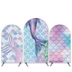 three different colored mermaid themed ironing boards