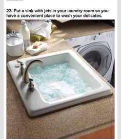 an image of a sink in the middle of a counter top with water coming out of it