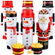 three christmas nutcrackers are standing next to each other and one has a santa clause on it