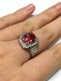 "ONE OF A KIND RUBELLITE TOURMALINE RING! SPARKLING CERTIFIED, UNTREATED/Unheated, 3.31 CARATS RUBELLITE TOURMALINE, accented with 38 pcs of E/VS, natural diamonds, weighting at 0.85 carat. Set in custom-designed, 18K solid white gold ring😆Precious and pretty❤️If you are looking for something pink to match your outfits 👚that has investment value as well as timelessness, well, this ring is just perfect for you! SUGGESTED RETAIL VALUE: $9,500 RUBELLITE: Weight: 3.31 carats Shape: Oval Cut: Brill Oval Pink Platinum Jewelry, Pink Oval Platinum Jewelry, Pink Sapphire Ring In Platinum, Gia Certified Oval Pink Ruby Ring, Gia Certified Pink Ruby Ring, Luxury Pink Oval Halo Ring, Pink Ruby Ring In Platinum, Pink Oval Halo Ring For Formal Occasions, Formal Oval Pink Sapphire Ring