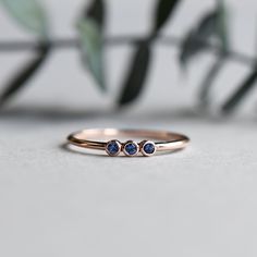 -A slim, simple thin ring with three natural sapphire stones. -Yellow gold and rose gold available. -Solid 14k rose gold fully hallmarked. -Approx 1.3mm band width with 1.75mm sapphire. -Diamonds and other gemstones are available, please contact me for custom orders. All of our jewelry will arrive in custom packaging ready for gift giving. Sapphire Stones, Marquise Ring, Ring Birthstone, Sapphire Stone, Ring Dainty, Natural Sapphire, Custom Packaging, Dainty Ring, Ring Engagement