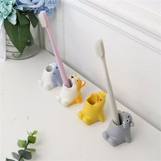 Description: By keeping your toothbrush clean and dry, keeping it upright and within reach, and with its very cute animal shape, this toothbrush holder will liven up your bathroom cabinet and make your kids love brushing their teeth. Very practical, this toothbrush holder is easy to clean because the surface is very smooth and very durable and delicate because of the high quality material used. It is made of high quality resin material. There are 4 different sizes for you to choose. This toothbr Cartoon Toothbrush, Desktop Gadgets, Tooth Brush Holder, Ceramic Toothbrush Holder, Rack For Bathroom, Toothbrush And Toothpaste Holder, Toothbrush Holders, Toothpaste Holder, Creative Bathroom