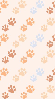 an animal paw print pattern on a white background with orange, blue and pink colors