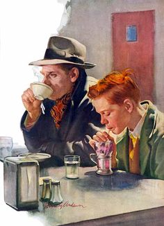 two men are sitting at a table drinking from cups and looking at something on the table