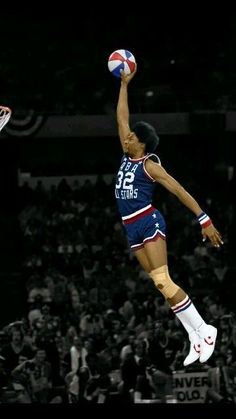 a basketball player jumping in the air with a ball