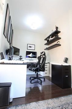 a home office with black and white decor